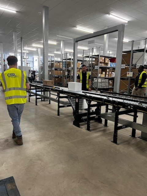 Fulfilment centre with Interroll motorised roller conveyor with tote bin on