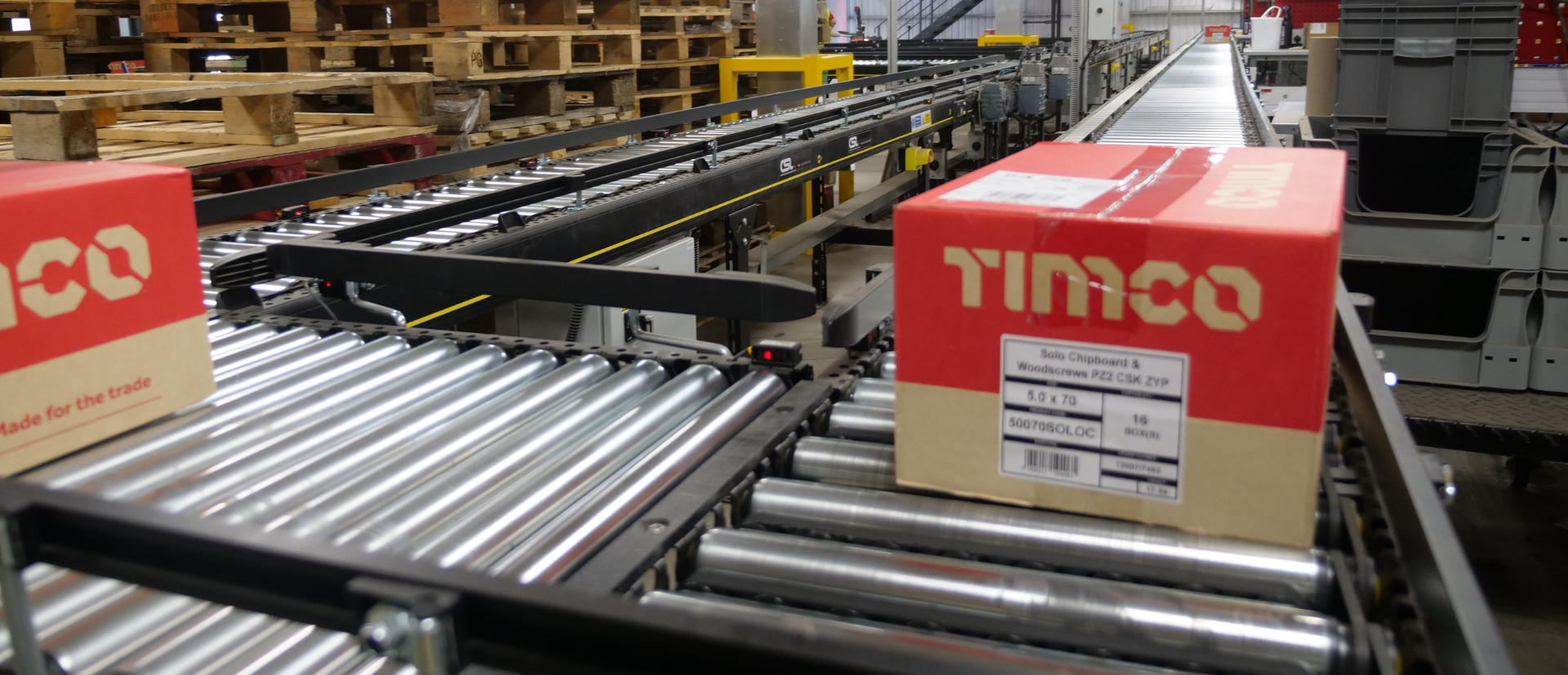Boxes on a powered roller conveyor